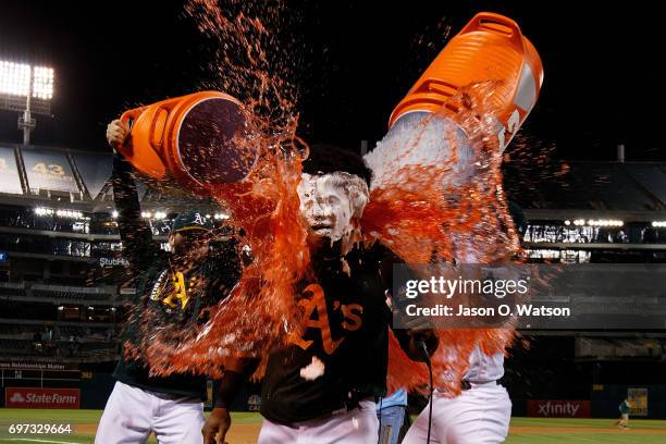 Khris Davis of the Oakland Athletics has Gatorade poured on him after hitting a two run walk off single after the game against the New York Yankees...