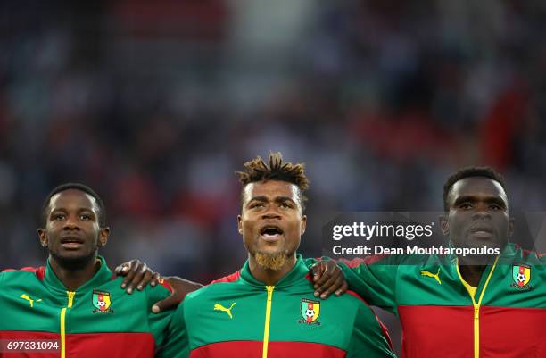 Amaud Djoum, Adolphe Teikeu and Michael Ngadeu-Ngadjui of Cameroon line up for the national anthem prior to the FIFA Confederations Cup Russia 2017...