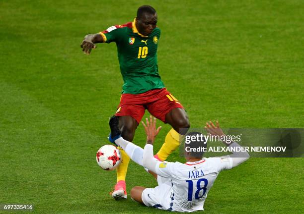 Chile's defender Gonzalo Jara challenges Cameroon's forward Vincent Aboubakar during the 2017 Confederations Cup group B football match between...