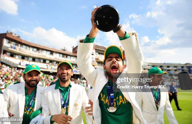 Babar Azam of Pakistan celebrates with the trophy during the ICC Champions Trophy Final match between India and Pakistan at The Kia Oval on June 18,...