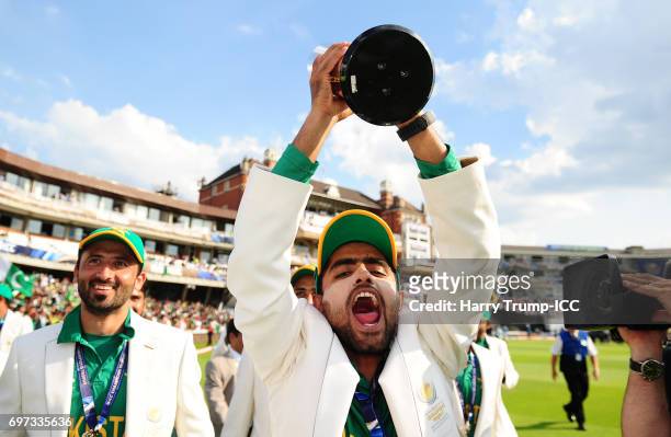 Babar Azam of Pakistan celebrates with the trophy during the ICC Champions Trophy Final match between India and Pakistan at The Kia Oval on June 18,...