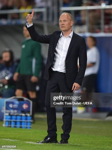 Niels Frederiksen, coach of Denmark gives his team instructions during the UEFA European Under-21 Championship Group C match between Denmark and...