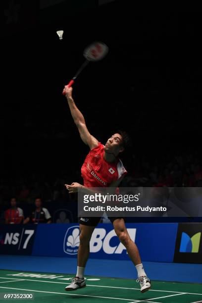 Kazumasa Sakai of Japan competes against Kidambi Srikanth of India during Men's Single Final match of the BCA Indonesia Open 2017 at Plenary Hall...