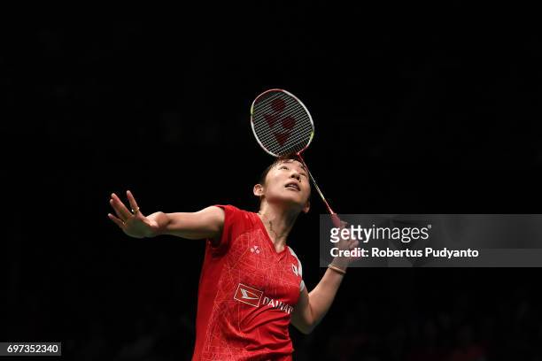 Sayaka Sato of Japan competes against Sung Ji Hyun of Korea during Women's Single Final match of the BCA Indonesia Open 2017 at Plenary Hall Jakarta...