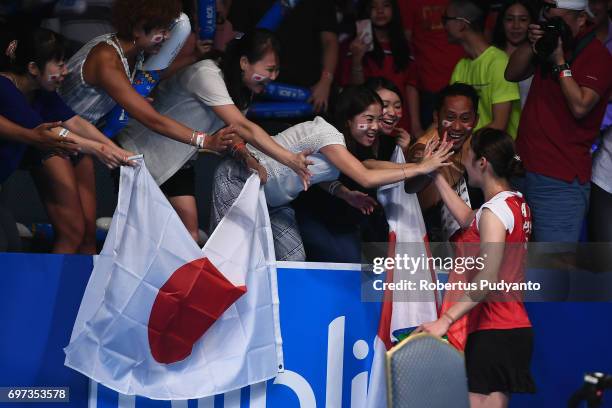 Sayaka Sato of Japan greets the Japanese fans after beating Sung Ji Hyun of Korea during Women's Single Final match of the BCA Indonesia Open 2017 at...