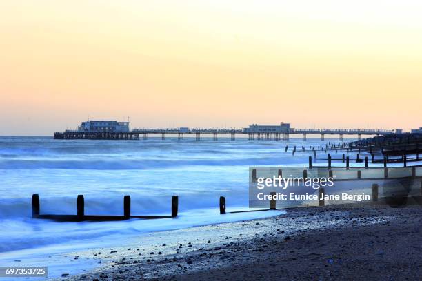 the blue hour - worthing pier stock pictures, royalty-free photos & images