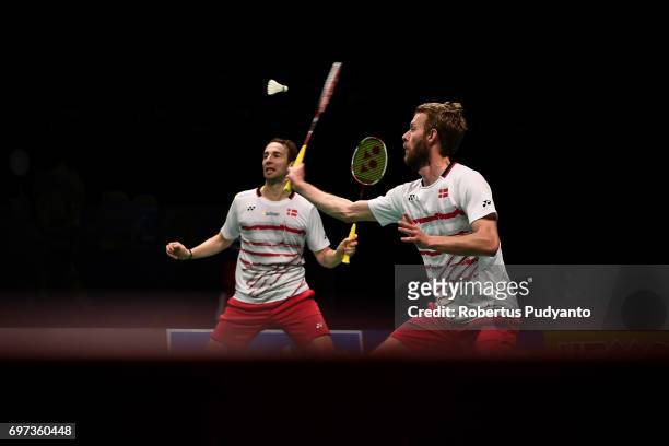 Mathias Boe and Carsten Mogensen of Denmark compete against Li Junhui and Liu Yuchen of China during Men's Double Final match of the BCA Indonesia...
