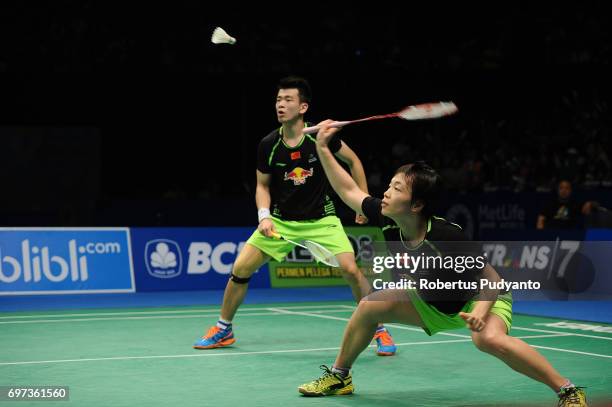 Zheng Siwei and Chen Qingchen of China compete against Tontowi Ahmad and Liliyana Natsir of Indonesia during Mixed Double Final match of the BCA...