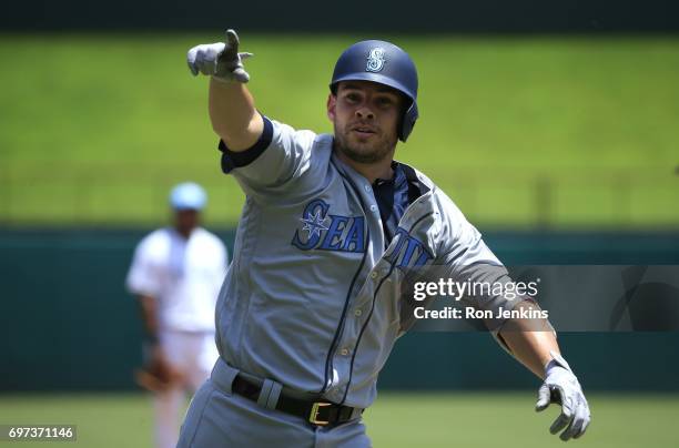 Danny Valencia of the Seattle Mariners celebrates his two-run home run against the Texas Rangers during the first inning at Globe Life Park in...