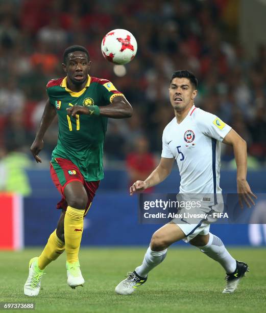 Olivier Boumal of Cameroon attempts to take the ball past Francisco Silva of Chile during the FIFA Confederations Cup Russia 2017 Group B match...