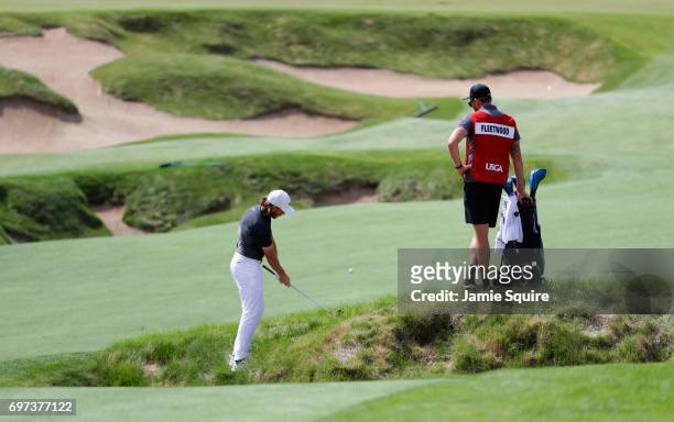 Tommy Fleetwood of England plays his shot on the fourth hole during the final round of the 2017 U.S. Open at Erin Hills on June 18, 2017 in Hartford,...