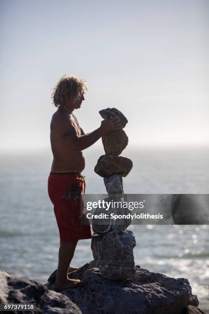 Man Balancing Rocks Balancing Rocks Isolated Photos and Premium High Res Pictures - Getty ...