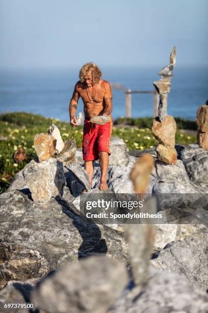 Man Balancing Rocks Balancing Rocks Isolated Photos and Premium High Res Pictures - Getty ...