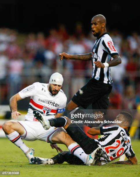 Lucas Pratto of Sao Paulo and Alex Silva of Atletico MG in action during the match between Sao Paulo and Atletico MG for the Brasileirao Series A...