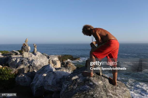 Man Balancing Rocks Balancing Rocks Photos and Premium High Res Pictures - Getty Images