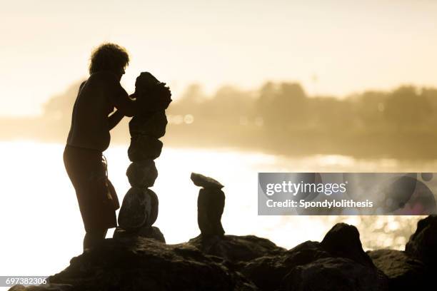 Man Balancing Rocks Balancing Rocks Photos and Premium High Res Pictures - Getty Images
