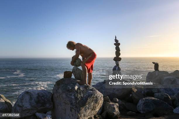 Man Balancing Rocks Balancing Rocks Photos and Premium High Res Pictures - Getty Images
