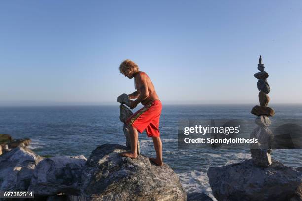Man Balancing Rocks Balancing Rocks Photos and Premium High Res Pictures - Getty Images