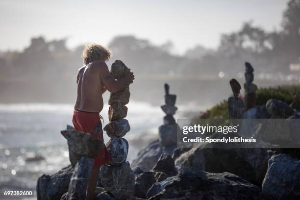 Man Balancing Rocks Balancing Rocks Photos and Premium High Res Pictures - Getty Images