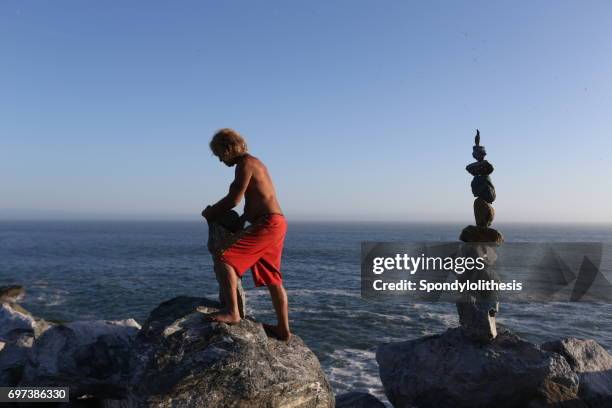 Man Balancing Rocks 751 Balancing Rocks Stock Photos, High-Res Pictures, and Images - Getty ...