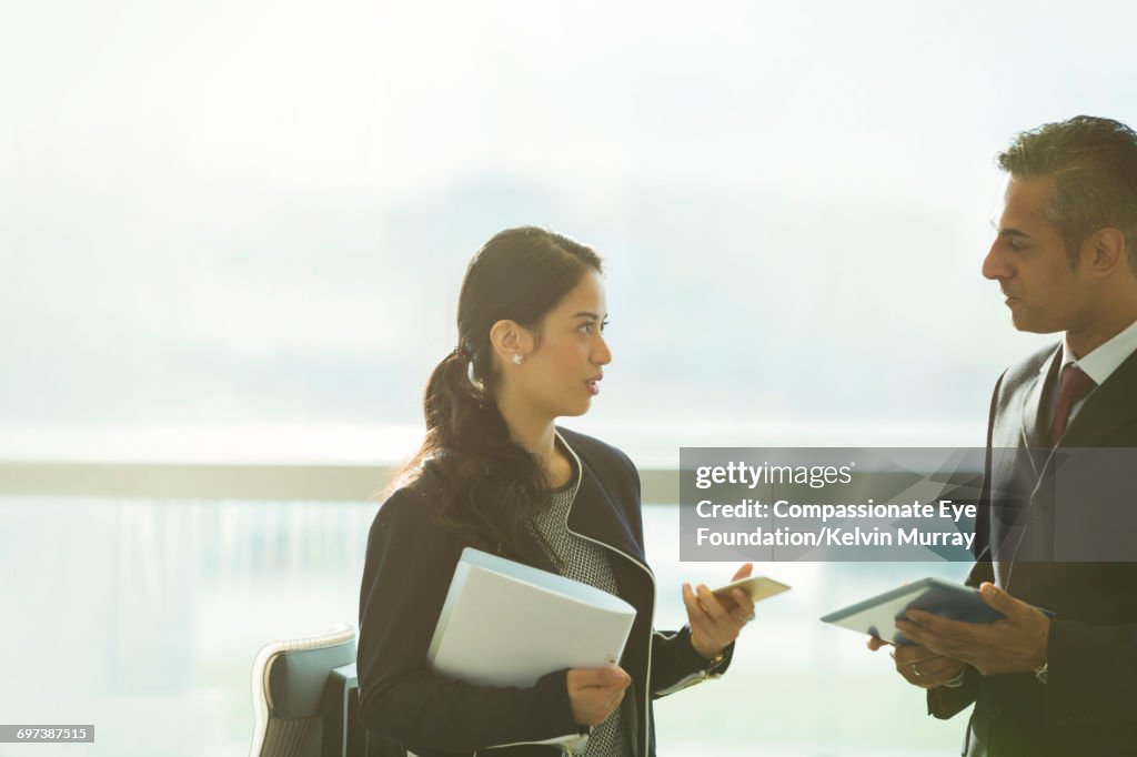 Business people using digital tablet in office