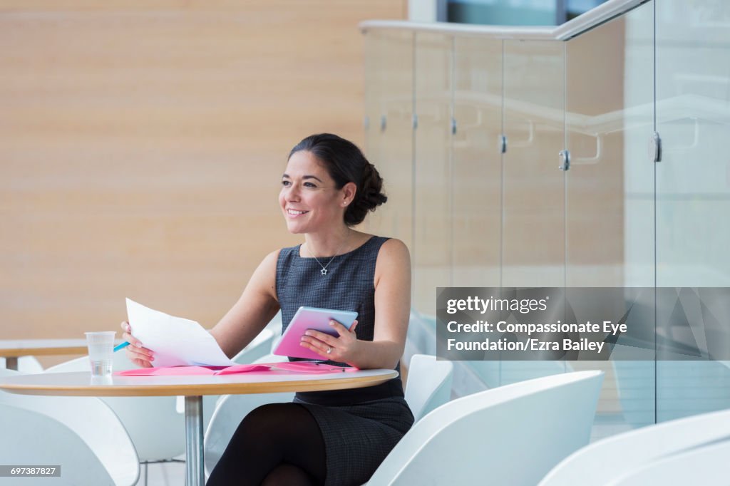 Businesswoman working in cafe