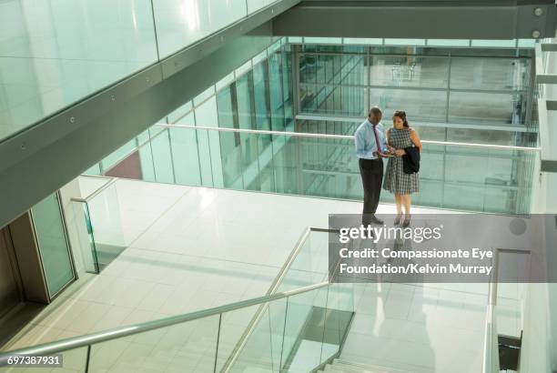 business people discussing project in office - atrio fotografías e imágenes de stock