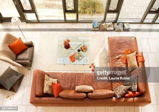 modern living room with leather sofa from above - coffee table from above stock-fotos und bilder