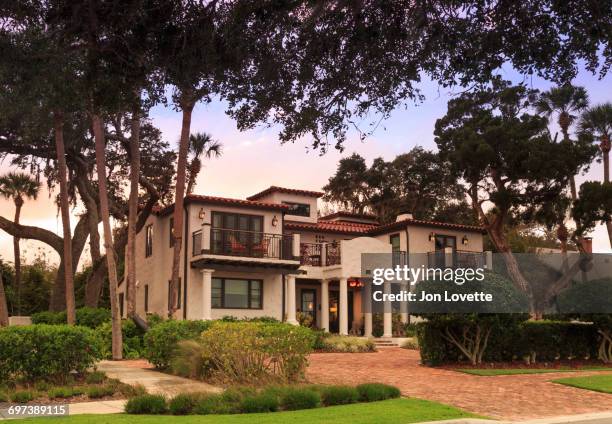 front of home in mediterranean style - florida mansions stockfoto's en -beelden