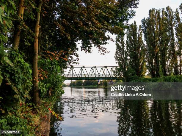 a bridge over a river in berlin - neukölln stock-fotos und bilder