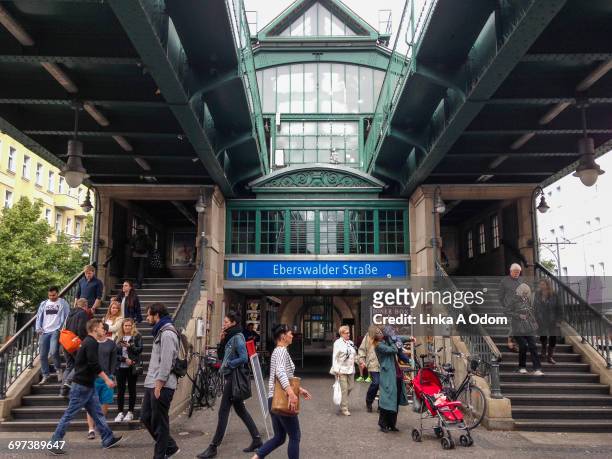 people entering and exiting a train station. - prenzlauer berg stock pictures, royalty-free photos & images