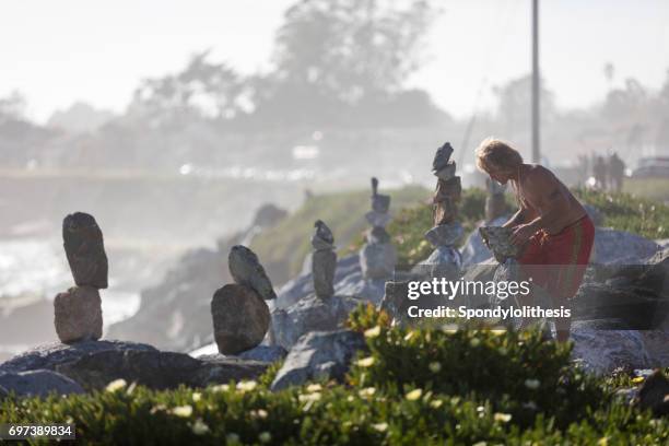 Man Balancing Rocks 751 Balancing Rocks Stock Photos, High-Res Pictures, and Images - Getty ...