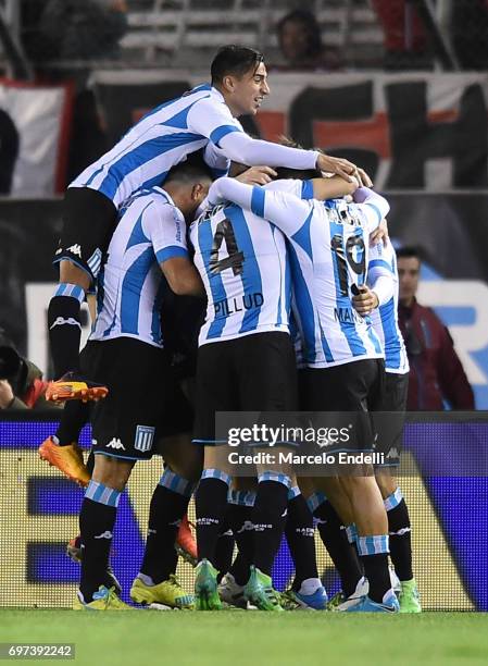 Miguel Barbieri of Racing Club celebrates with teammates Diego Gonzalez, Sergio Vittor and Ivan Pillud after scoring the second goal of his team...