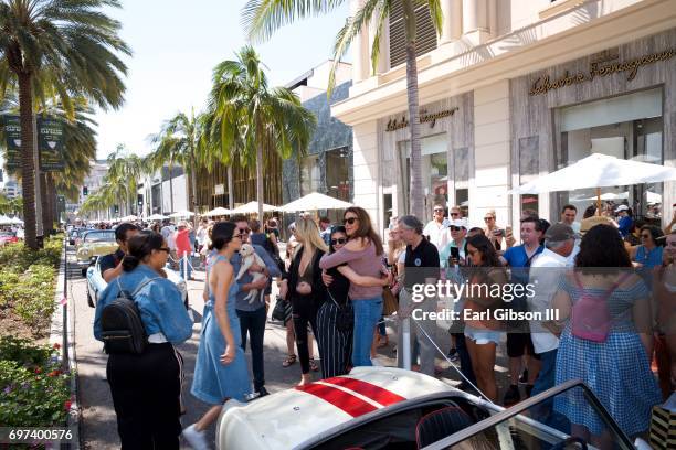 Kendall Jenner and Kylie Jenner greet Caitlyn Jenner at the Rodeo Drive Concours d'Elegance where she displayed her Austin-Healey Sprite on June 18,...