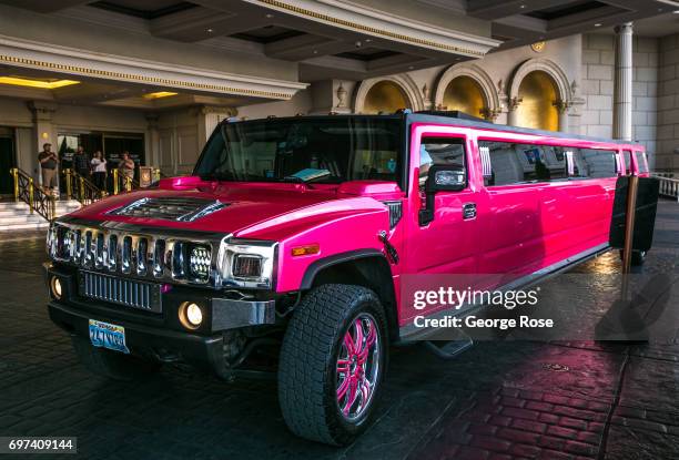 Long Hummer stretch limo is parked at the Caesars Palace Hotel & Casino valet parking on May 29, 2017 in Las Vegas, Nevada. Tourism in America's "Sin...