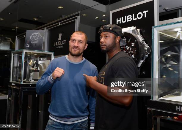 Boxer and Hublot ambassador Sergey Kovalev poses with a fan during his visit to the Hublot Boutique at The Forum Shops at Caesars on June 18, 2017 in...