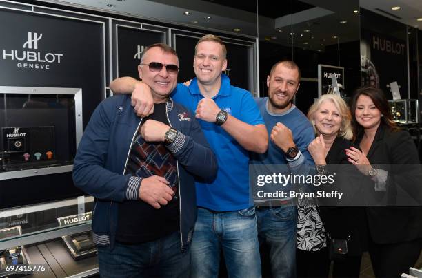 Boxing trainer Egis Klimas, Andrius Krukonis and boxer and Hublot ambassador Sergey Kovalev pose with employees during their visit the Hublot...