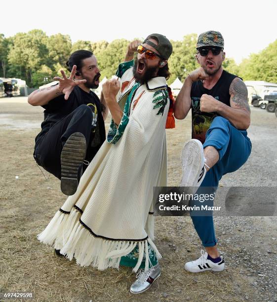Tomo Milicevic, Jared Leto, and Shannon Leto of Thirty Seconds to Mars pose backstage during the 2017 Firefly Music Festival on June 18, 2017 in...