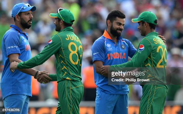 Virat Kohli and Yuvraj Singh of India shakes hands with Shadab Khan and Junaid Khan of Pakistan after Pakistan won the ICC Champions Trophy final...