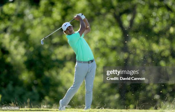 Brooks Koepka of the United States plays his tee shot at the par 3, 16th hole during the final round of the 117th US Open Championship at Erin Hills...