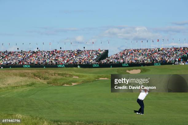 Hideki Matsuyama of Japan plays his second shot at the par 5, 18th hole during the final round of the 117th US Open Championship at Erin Hills on...