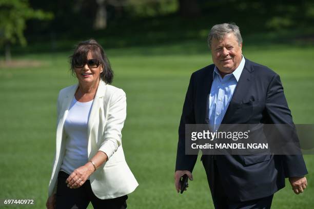 Viktor and Amalija Knavs, the parents of US First Lady Melania Trump, walk across the South Lawn upon return to the White House on June 18, 2017 in...