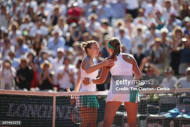 French Open Tennis Tournament - Day Fourteen. Jelena Ostapenko of Latvia is congratulated by Simona Halep of Romania after her win in the Women's...