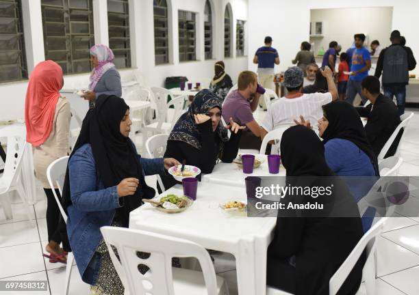 Muslim women attend an iftar dinner during the holy month of Ramadan, which is the ninth month of the Islamic calendar, at Masjid El Nur in Rio De...