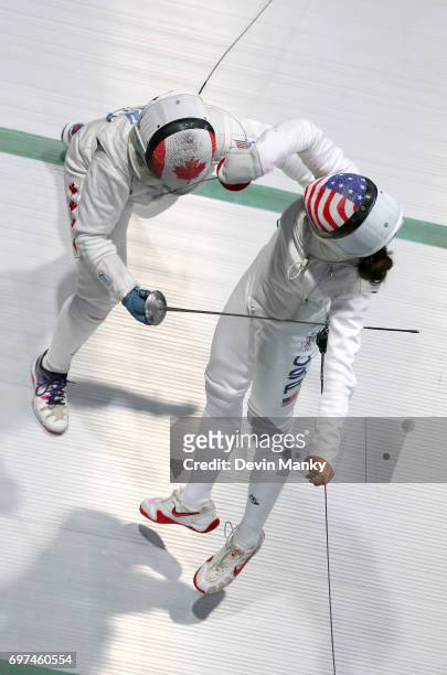 Kelleigh Ryan of Canada fences Nicole Ross of the USA during the Team Women's Foil event on June 18, 2017 at the Pan-American Fencing Championships...