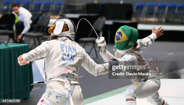 Ana Beatriz Bulcao of Brazil attacks Kelleigh Ryan of Canada during the Team Women's Foil event on June 18, 2017 at the Pan-American Fencing...