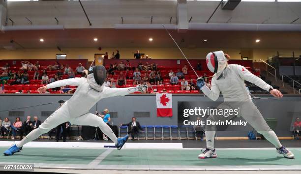 Margaret Lu of the USA attacks Kelleigh Ryan of Canada during the Team Women's Foil event on June 18, 2017 at the Pan-American Fencing Championships...