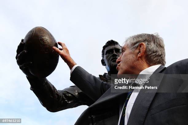 Former All Blacks player Sir Colin Meads is seen in front of a new statue of himself on June 19, 2017 in Te Kuiti, New Zealand. The 1.5 x life size...