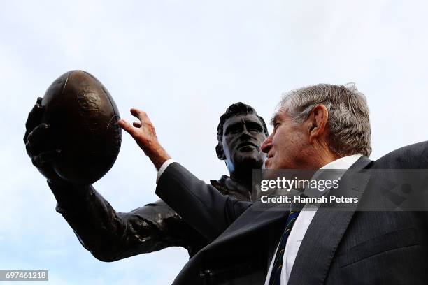 Former All Blacks player Sir Colin Meads is seen in front of a new statue of himself on June 19, 2017 in Te Kuiti, New Zealand. The 1.5 x life size...