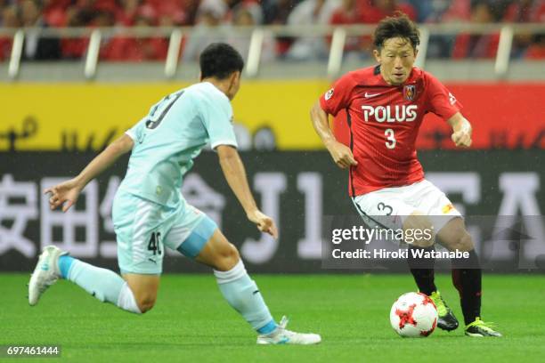 Tomoya Ugajin of Urawa Red Diamonds in action during the J.League J1 match between Urawa Red Diamonds and Jubilo Iwata at Saitama Stadium on June 18,...